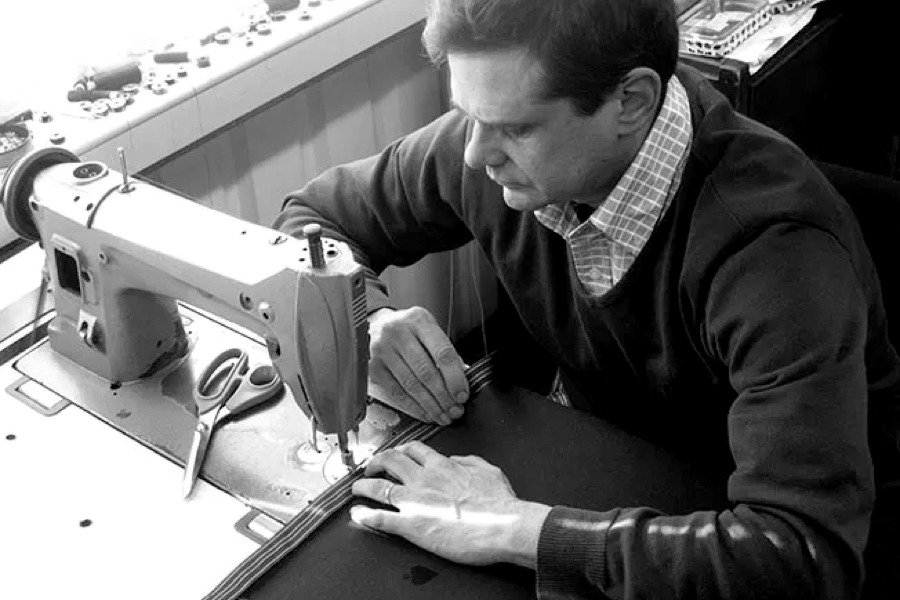 Master craftsman Simon Lucas working on a luxury table cloth